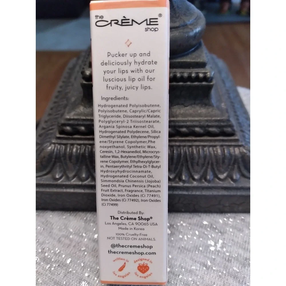 The Creme Shop Luscious Lip Oil Peach Essense Jojoba Oil Coconut Oil .12 OZ/3.4g